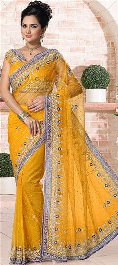 741215 Yellow  color family Bridal Wedding Sarees, Party Wear Sarees in Net fabric with Stone work   with matching unstitched blouse.