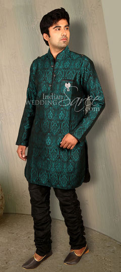 Green color Kurta Pyjamas in Silk fabric with Thread work