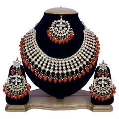 Gold Rodium Polish Red and Maroon, White and Off White color Necklace in Metal Alloy studded with Kundan