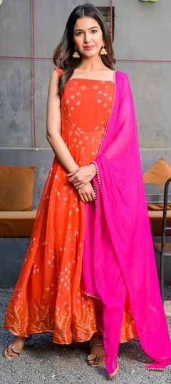 Orange color Gown in Chiffon fabric with Bandhej, Printed work