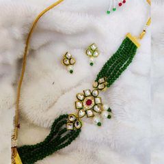 Gold Rodium Polish Green color Necklace in Brass studded with Kundan