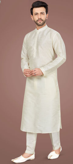 Yellow color Kurta Pyjamas in Art Silk fabric with Thread work