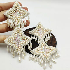 Gold Rodium Polish White and Off White color Earrings in Metal Alloy studded with Pearl