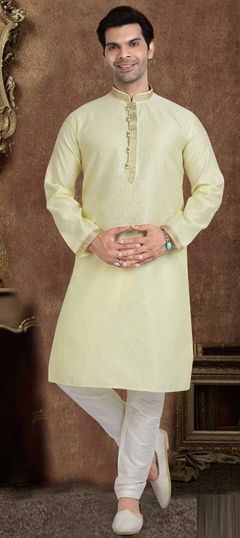 Yellow color Kurta Pyjamas in Jacquard fabric with Lace work