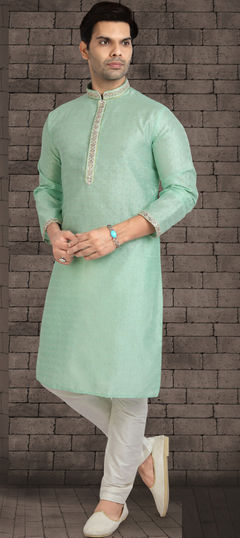 Green color Kurta Pyjamas in Jacquard fabric with Lace work