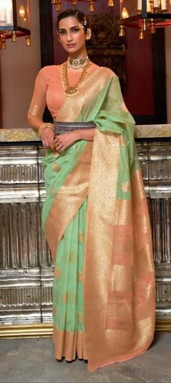 Green color Saree in Linen fabric with Weaving work