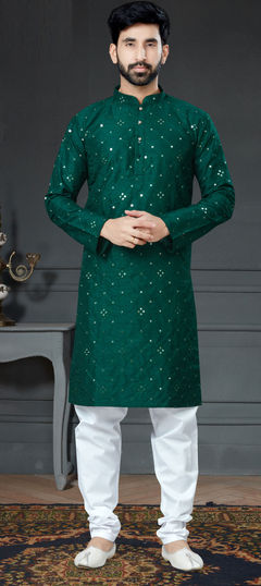 Green color Kurta Pyjamas in Art Silk fabric with Embroidered, Thread work