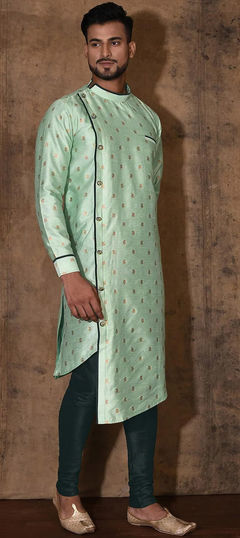 Green color Kurta Pyjamas in Dupion Silk fabric with Weaving work