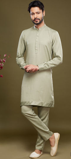 Green color Kurta Pyjamas in Art Silk fabric with Thread work