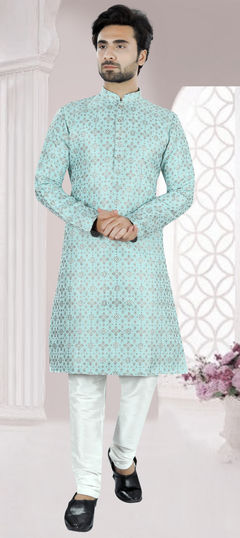 Blue color Kurta Pyjamas in Brocade fabric with Weaving work