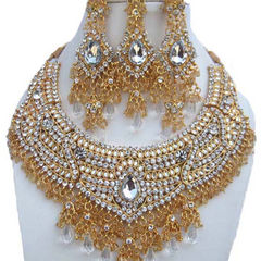 Gold Rodium Polish Gold color Necklace in Metal Alloy studded with Austrian diamond, CZ Diamond, Kundan
