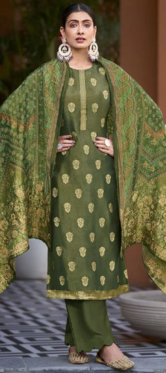 Green color Salwar Kameez in Silk fabric with Weaving work