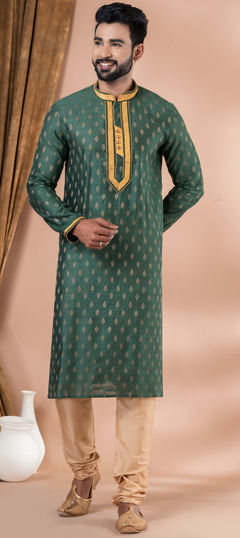 Green color Kurta Pyjamas in Jacquard fabric with Weaving work