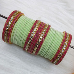 Gold Rodium Polish Green color Bangles in Metal Alloy studded with Kundan
