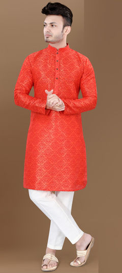 Orange color Kurta Pyjamas in Rayon fabric with Weaving work