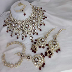 Gold Rodium Polish Red and Maroon color Necklace in Metal Alloy studded with CZ Diamond, Kundan, Pearl