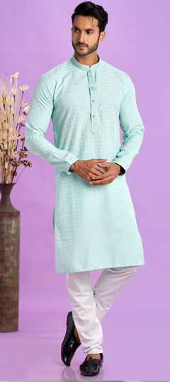 Green color Kurta Pyjamas in Art Silk fabric with Embroidered, Thread work