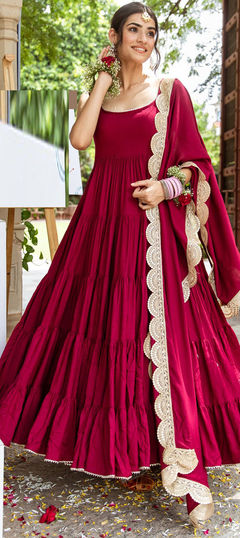 Red and Maroon color Gown in Rayon fabric with Lace work