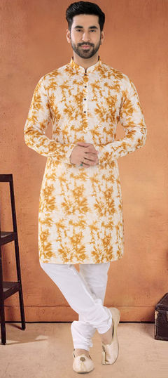 Yellow color Kurta Pyjamas in Cotton fabric with Patch work