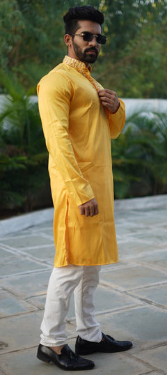 Yellow color Kurta Pyjamas in Silk fabric with Mirror work