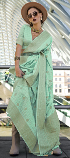 Green color Saree in Silk cotton fabric with Weaving work