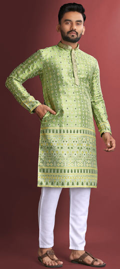 Green color Kurta Pyjamas in Jacquard fabric with Weaving work