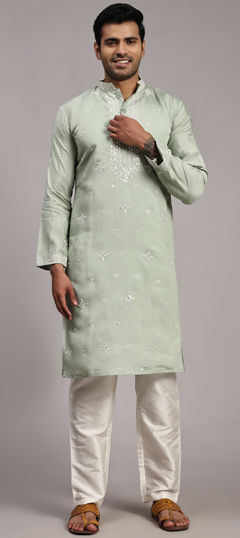 Green color Kurta Pyjamas in Silk fabric with Embroidered work