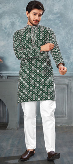 Green color Kurta Pyjamas in Rayon fabric with Embroidered, Thread work