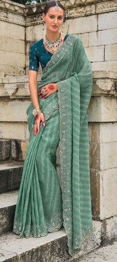 Green color Saree in Tissue fabric with Cut Dana, Moti, Zircon work