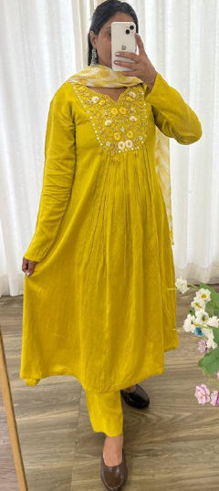 Yellow color Salwar Kameez in Muslin fabric with Bugle Beads, Cut Dana, Sequence work