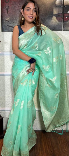 Green color Saree in Linen fabric with Weaving work