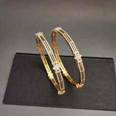 Gold Rodium Polish White and Off White color Bangles in Metal Alloy studded with CZ Diamond
