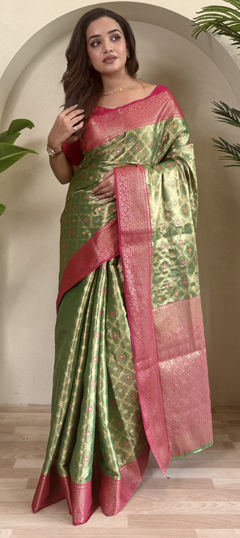 Green color Saree in Tissue fabric with Weaving, Zari work