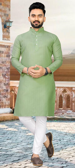 Green color Kurta Pyjamas in Cotton fabric with Weaving work