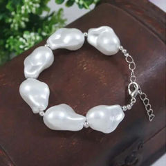 Gold Rodium Polish White and Off White color Bracelet in Brass studded with Pearl