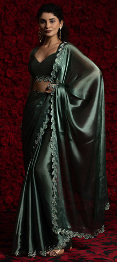 Green color Saree in Tissue fabric with Zircon work