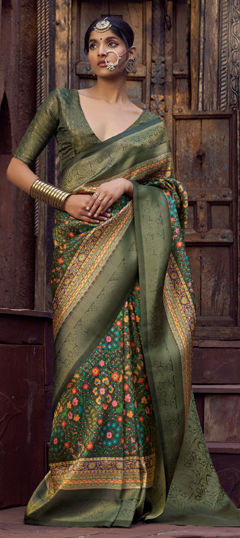 Green color Saree in Jacquard fabric with Weaving work