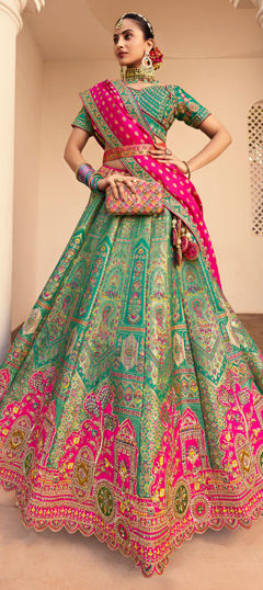 Green color Lehenga in Banarasi Silk fabric with Border, Embroidered, Printed, Resham, Stone, Weaving, Zari work