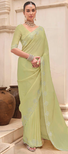 Green color Saree in Tissue fabric with Zircon work