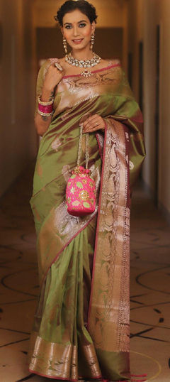 Green color Saree in Banarasi Silk fabric with Weaving work