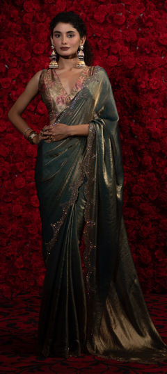 Blue color Saree in Tissue fabric with Border, Zircon work