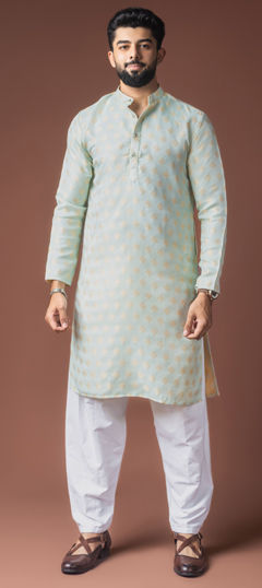 Green color Kurta Pyjamas in Jacquard fabric with Weaving work