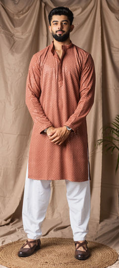 Orange color Kurta Pyjamas in Rayon fabric with Embroidered, Thread work