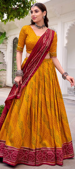 Yellow color Lehenga in Tussar Silk fabric with Bandhej, Gota Patti, Printed work