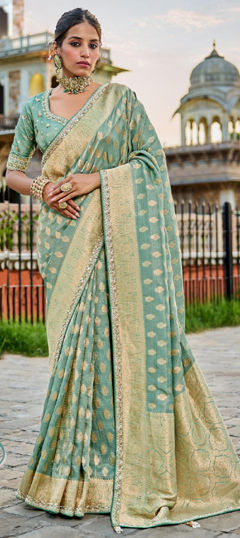 Green color Saree in Tissue, Viscose fabric with Bugle Beads, Weaving work