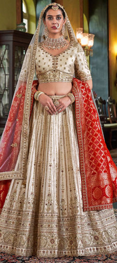 White and Off White color Lehenga in Silk fabric with Border, Embroidered, Sequence, Stone, Thread, Weaving, Zari work