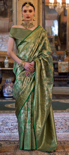 Green color Saree in Tissue fabric with Weaving work