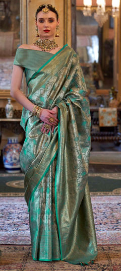 Green color Saree in Tissue fabric with Weaving work