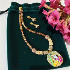 Enamel Beige and Brown color Pendant in Brass, Metal Alloy studded with Beads