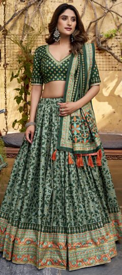 Green color Lehenga in Tussar Silk fabric with Border work